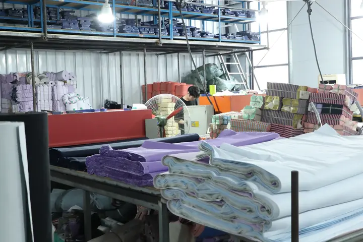 Spread fabric layers ready for the cutter