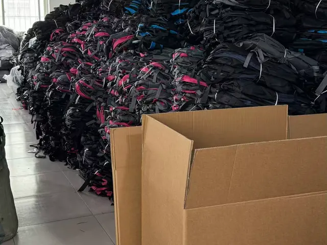 Export cartons of finished backpacks marked and ready for loading