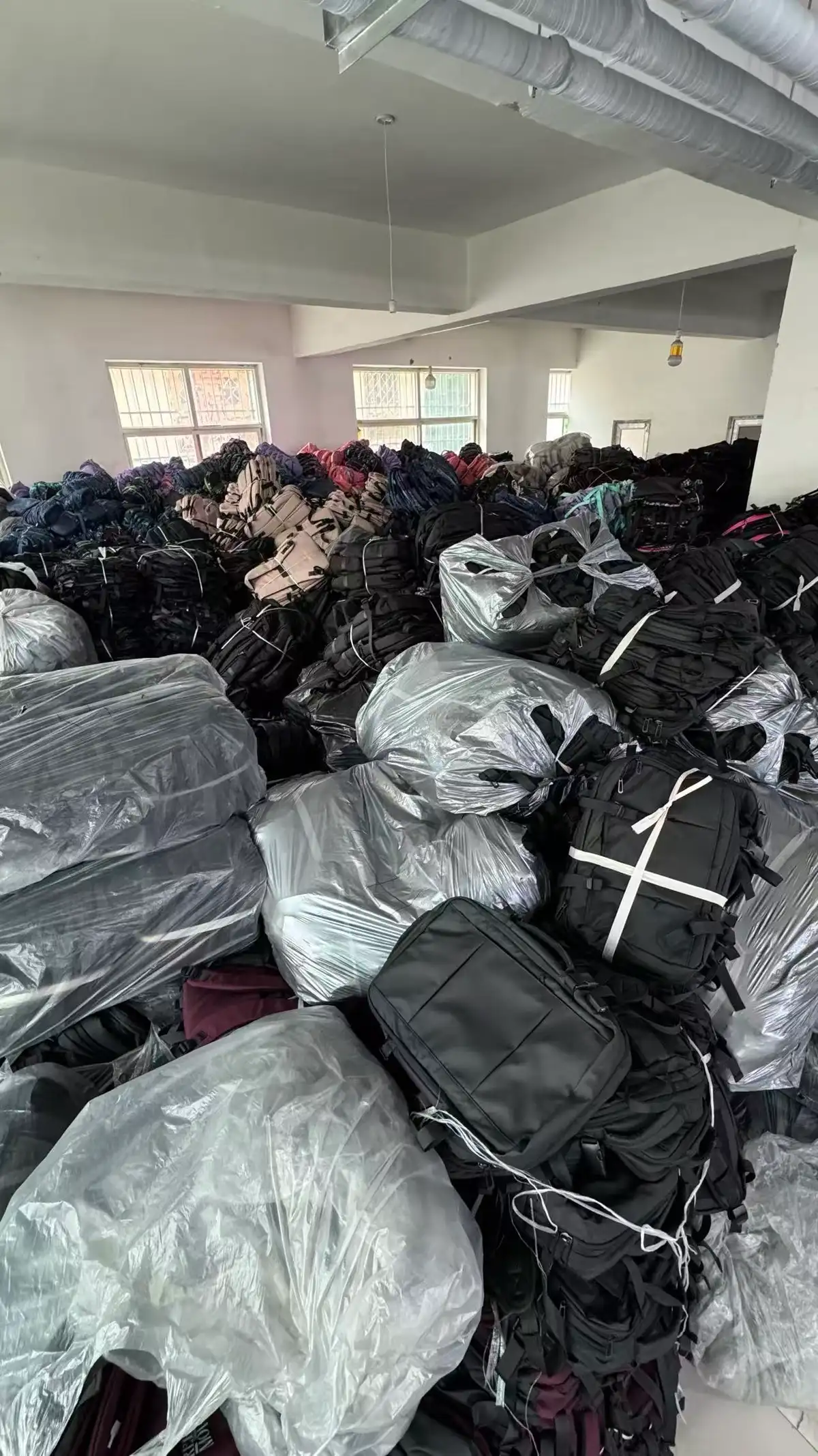 Finished backpacks in poly bags awaiting cartoning