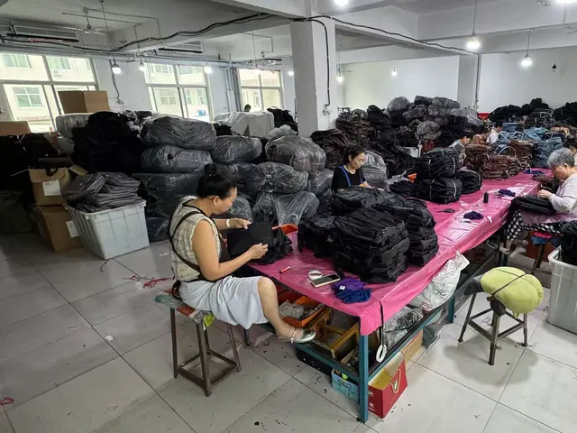 QC inspector examining a backpack