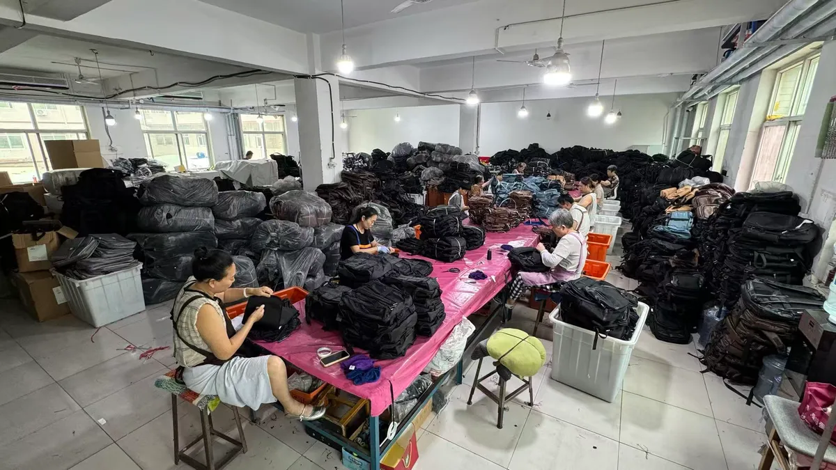 Senszx QC team performing 100% final inspection on school backpacks