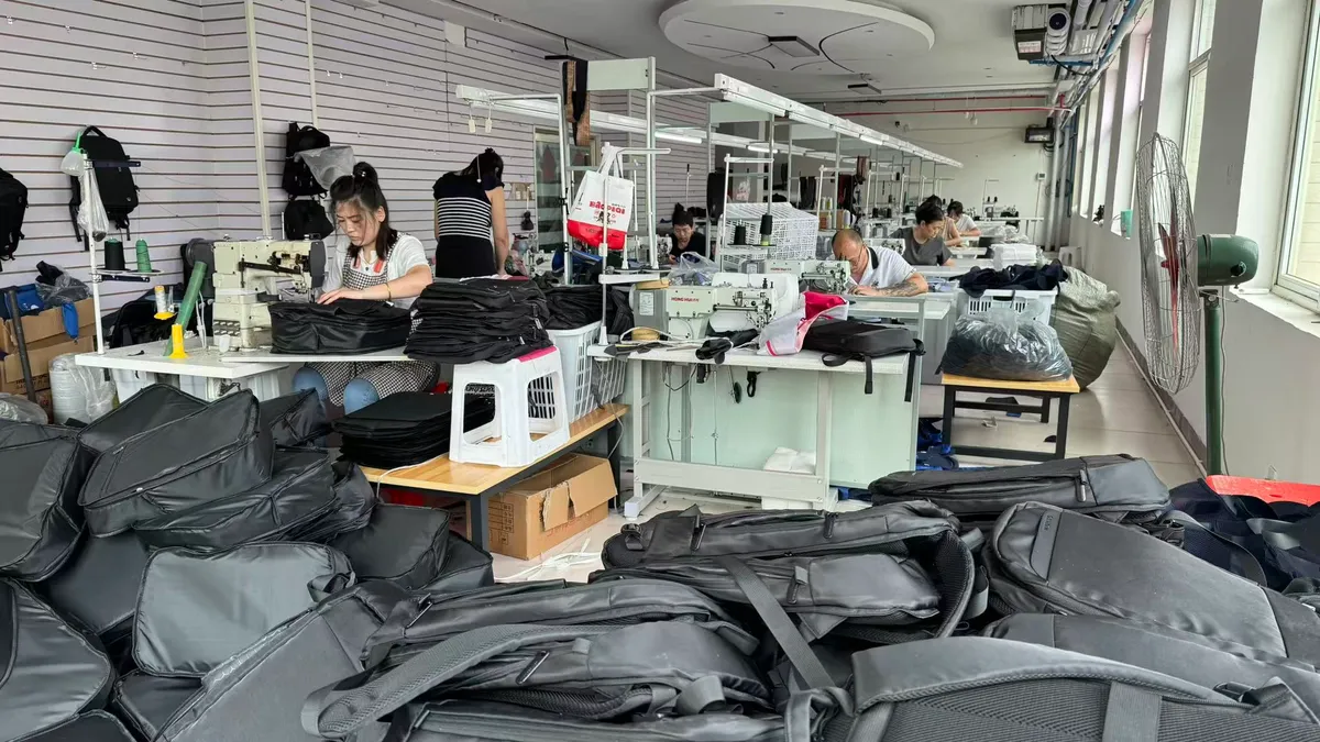 Sewing workshop producing laptop backpacks