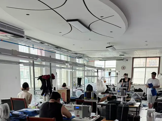 Wide view of the Senszx backpack sewing workshop with parallel production lines