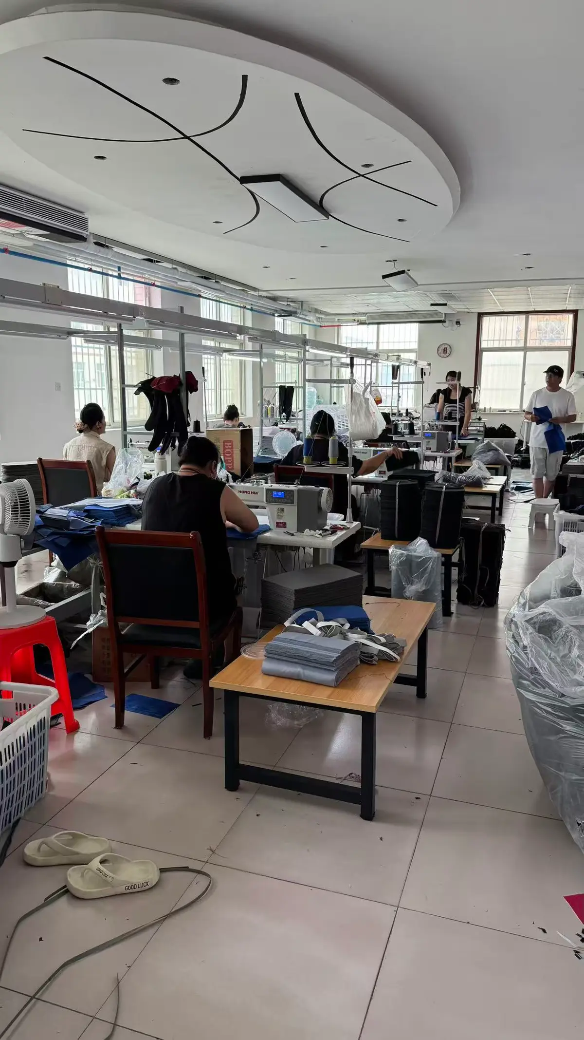 Senszx sewing workshop with operators assembling backpack panels