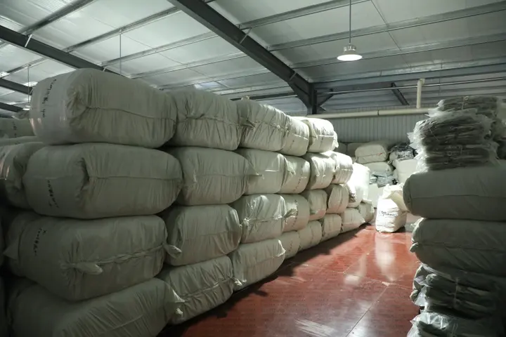 Aisle between bales of ready-made backpacks